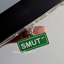 Load image into Gallery viewer, Kindle Charm, USB-C Dust Plug Charm, Badge Reel Charm, Smut Street Name Charm, Book Lover, Gift for Her, Adult Gag Gift, Cute Phone Charm