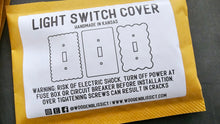 Load image into Gallery viewer, a close up of a light switch cover
